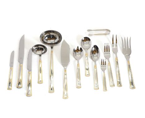 A canteen of stainless steel flatware, the handles with a golden rim design, in a wooden set of drawers,47cm wide33cm deep25c