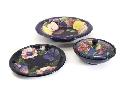 A collection of Moorcroft pottery items, comprising a Wisteria bowl, 31cm diameterIris dish and cover, 16.5cm diameterand an 