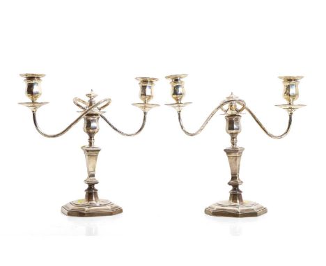A pair of silver candelabra, by Mappin &amp; Webb, London 1932, in the early 18th century style, each with a removable two-br