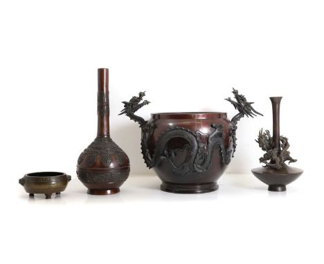A Japanese bronze jardinière,  set with dragon handles, 34cm high, raised on a 20th century associated wooden urn stand, 76cm