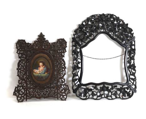 ▲ A pierced and carved frame,  containing a painted porcelain plaque of the Madonna and child,  49 x 40cm together with a Chi