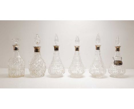 A group of six silver-mounted cut glass decanters, comprising a set of four John Walsh Walsh 'Kenilworth' pattern examples, e