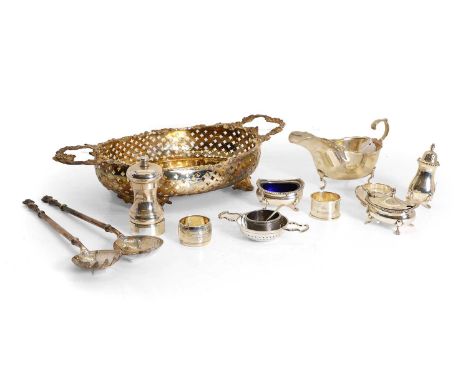 A silver sauce boat, Birmingham 1922, together with a collection of silver items to include a pepper grinder, 10.5cm high, a 
