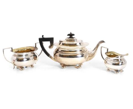 A silver three piece tea set, by Britton, Gould &amp; Co, Birmingham 1930, comprising a teapot with ebonised handle and finia