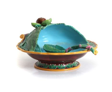 A George Jones majolica chestnut server and spoon, the half-covered leaf adorned dish with applied chestnut and undulating ri