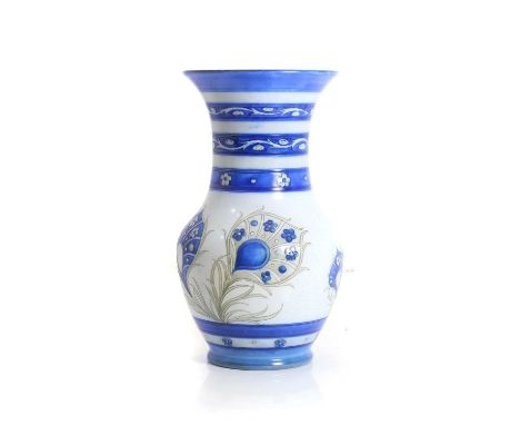 A Moorcroft 'Peacock Feather' design pottery vase, c.1930s, tubeline peacock feathers motif to the main body, painted blue ma