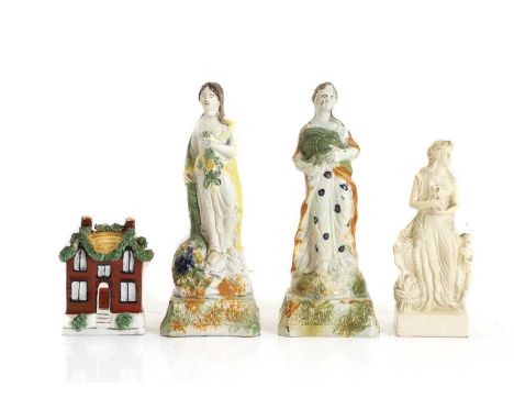 A group of English pottery, 19th century, a pair of prattware figures of the allegories of spring and autumn, 23cm high, a mo
