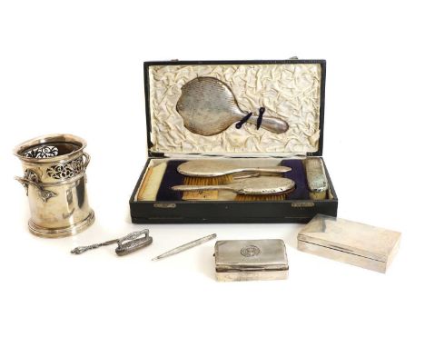 A collection of silver items, comprising a twin-handled bottle holder, by Mappin &amp; Webb, with a pierced border and turned