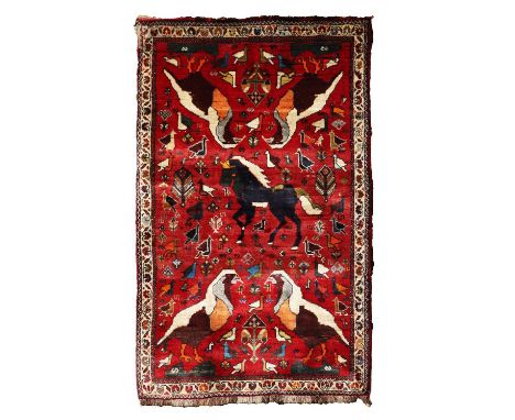 A Persian pictorial hunting rug, 20th century, the red ground with a stylished horse and four birds within a lighter ground,1