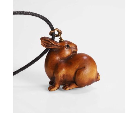 A Japanese wood carving, Meiji period (1868-1912), of a hare, signed Kogyoku, 2.6cm longCondition ReportDrilled for suspensio