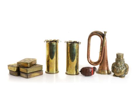A collection of brass militaria, comprising five Christmas 1914 tins, two commemorative World War 1 trench art shells, Boer W