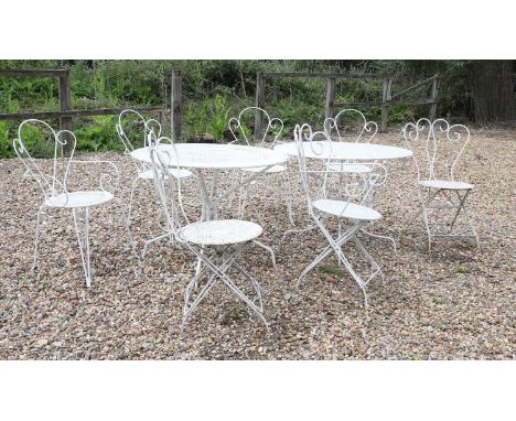 A French wirework garden table and chairs, the table of circular form on sabre supports,97cm diameter71cm hightogether with f