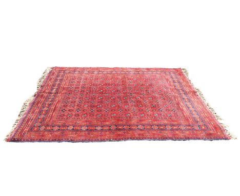 A Bokara rug, 20th century, with small repeating motifs to a red and blue ground within a multi border,288 x 100cmCondition R