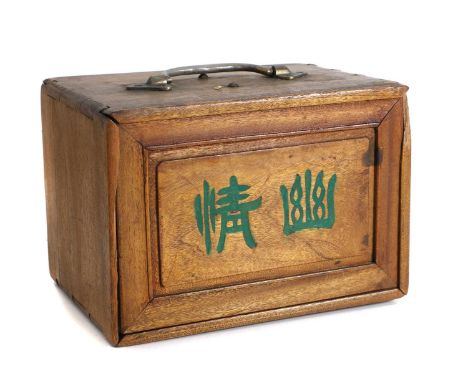 A Chinese cased mahogany mahjong set, 20th century, the sliding front enclosing five drawers, with bamboo and bone counters, 