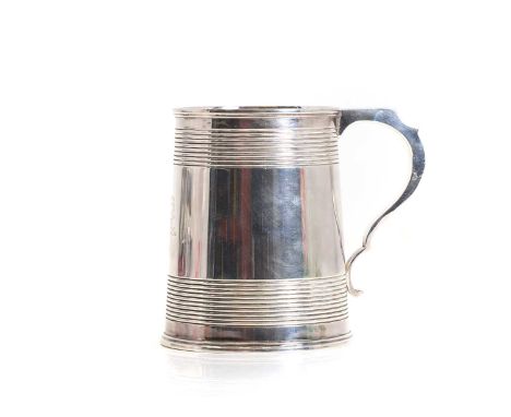 A silver tankard, by Martin, Hall &amp; Co, Sheffield 1907, crest of a phoenix head engraved to the front,11.4cm high12.2oztC