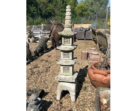 A composite Japanese style tiered garden lantern,  20th century, with four sections, 35cm wide 35cm deep 160cm high Provenanc