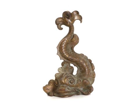 A Victorian brass door porter, late 19th century, possibly French, formed as a heraldic dolphin,23cm wide37cm high