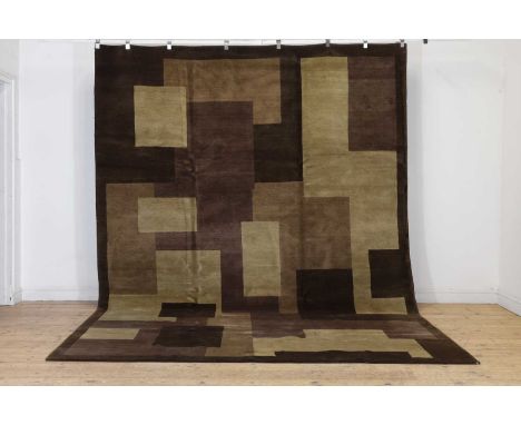 A contemporary carpet, of recent manufacture, with geometric motifs in tones of brown,260.5 x 365cm