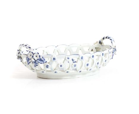 A First Period Worcester porcelain reticulated oval basket, c.1780, 'Guinea Flower' pattern, the exterior encrusted with flow