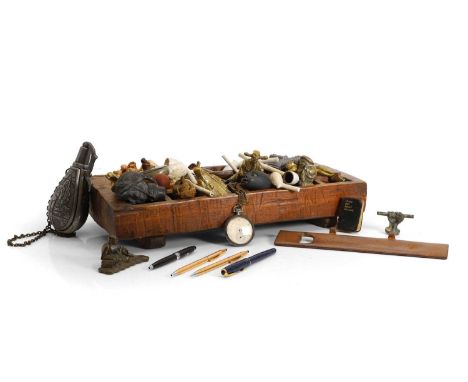 A collection of desk items,  to include white clay pipes, netsuke, white metal crucifixes, various modern asian coins, etc. (
