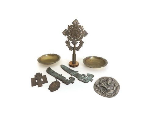 A collection of metalwares,  including an Ethiopian metalware cross, 39.5cm high, a pair of archaic style metal swords with d