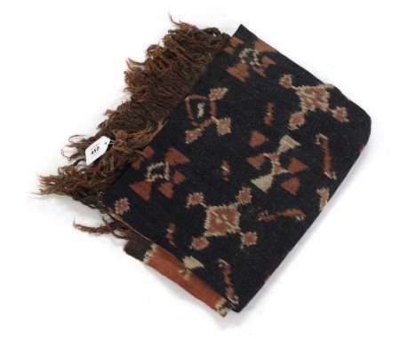 A cotton ikat shoulder cloth, 20th century, Indonesian, Sumba Island, the dyed threads woven in geometric and animal motifs t