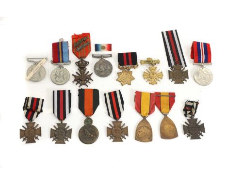 A group of medals, comprising a Queen's South Africa medal, with no ribbon, World War I Belgian Croix de Guerre medal with tw