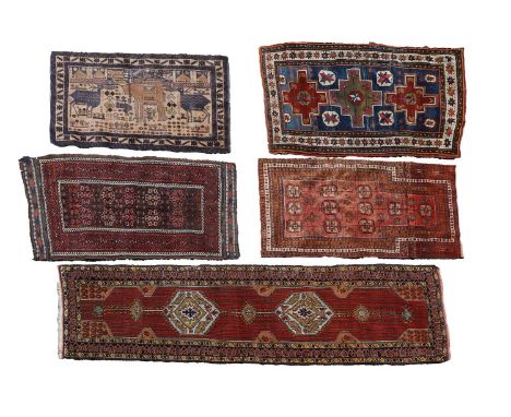 A Persian runner, with diamond medallions, to a red ground, with navy and buff borders,285 x 86cmtogether with four other rug