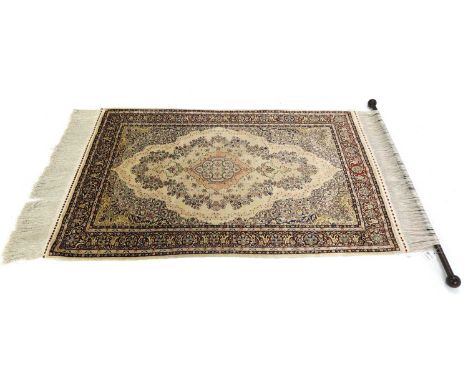 A Persian silk rug,  with white ground, and red floral border, with wooden hanging pole, 163 x 87cm  165 x 87cm overall Prove