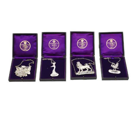 A group of four silver decanter labels, by Wyard Druitt &amp; Co Ltd, London, 1970/1971, comprising one in the form of a lion