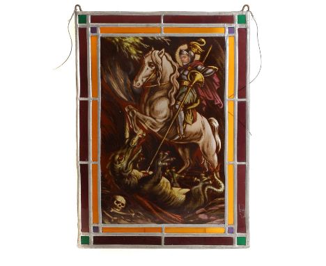 A stained glass panel of St George,  19th century, depicting St George on horseback slaying the dragon, 49 x 35cm Provenance: