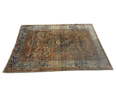 A Persian rug wool rug, the ivory ground with the rosette medallion to the central field, surrounded by blue blossom border, 
