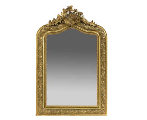 A gilt composition pier mirror, late 19th/early 20th century, the shaped bevelled plate within a vine and leaf frame with Roc