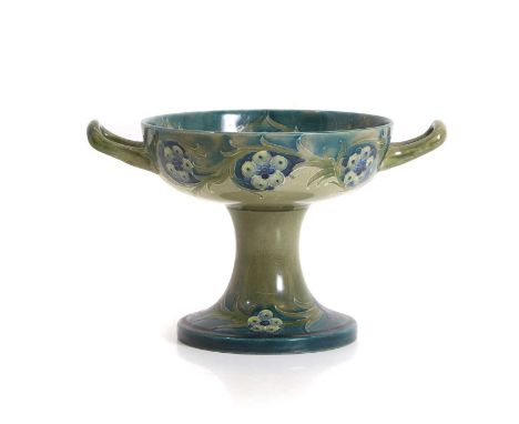 A William Moorcroft Florian ware twin-handled tazza, tubelined with flowers and scrolling foliage, stamped 'Moorcroft Burslem