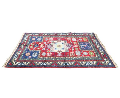 A Kazak rug, 20th century, with central mihrab, to a dark ground,277 x 170cm Condition ReportCouple of small stains to pile. 