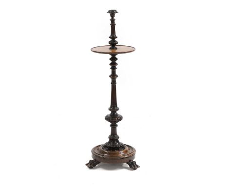 A Victorian rosewood candle stand, mid 19th century, with single socket on turned and fluted column with dished oval tier on 