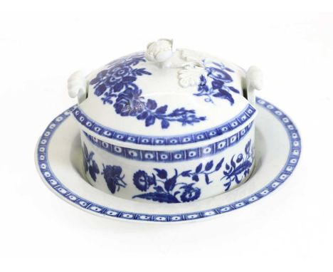 A First Period Worcester porcelain butter tub and stand, c.1780, rose centred spray, with molded rose handle, stand 16.5cm di