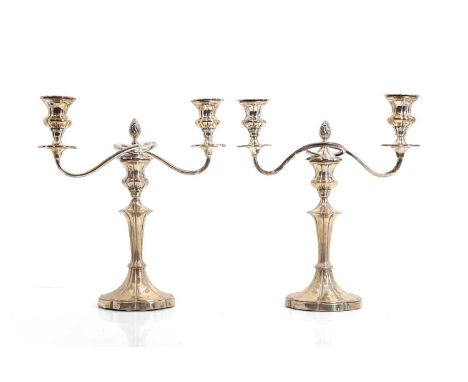 A pair of silver candelabra, by Mappin &amp; Webb, Sheffield 1929, each with a removable two-branch arm complete with scallop