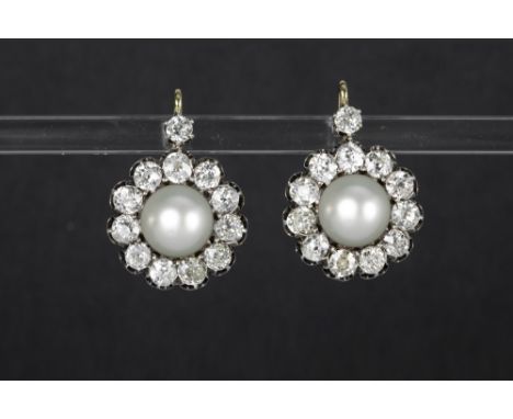 nice pair of 'antique' earrings in silver and yellow gold (18 carat) each with a white pearl surrounded by brilliants - in to