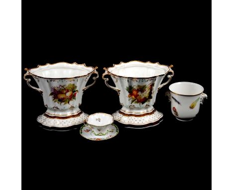 Two ceramic centrepieces, lobed oval form with floral and fruit panels, gilt rims and decoration, both on stands, overall hei