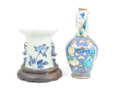 Persian pottery vase, Isnik palette, painted with figures taking tea, 28cm; and a Chinese porcelain jardiniere converted from