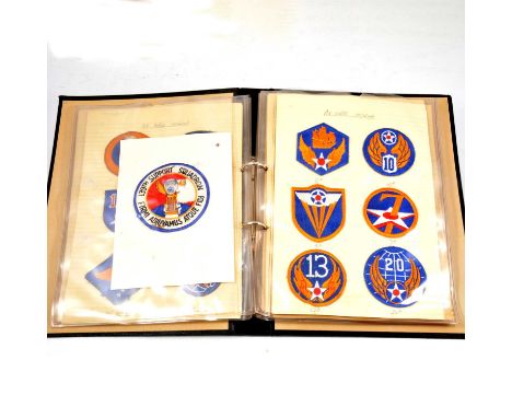 Three albums of US military division patches, to include an AA Airborne Division patch with signature of WW2 General Matthew 