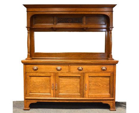 Edwardian oak mirror-back sideboard, Arts &amp; Crafts influence, moulded cornice, above a carved panel and shelf supported b