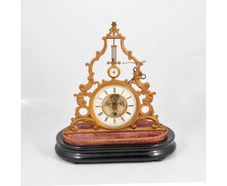 French mantel clock, gilt metal frame, pendulum above the circular diall with visible escapement, signed Brevete, Paris, time