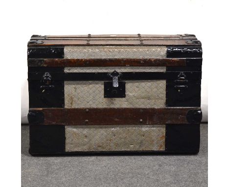 Metal covered wooden dome-top trunk, with wooden slats, papwer lined, width 72cm, height 52cm.