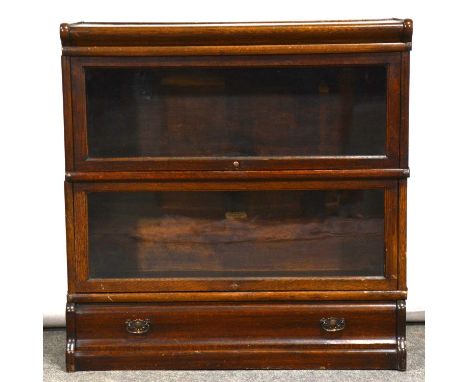 Oak two-heights sectional bookcase, labelled Globe-Wernicke, glazed flaps, plinth section incorporating a drawer, width 87cm,