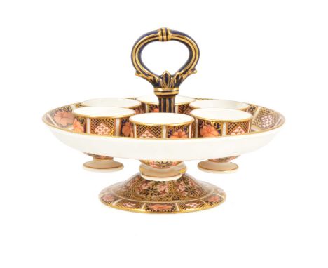 Royal Crown Derby Old Imari egg cup stand with six removable egg cups, central hoop handle, 12cm high.Condition report:Some v