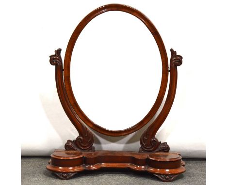 Victorian mahogany toilet mirror, oval glass, the base with two trinket compartments, height 81cm.