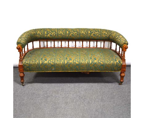 Edwardian oak sofa, hoop back with balustrated section, contemporary upholstery, carved detail, turned and fluted legs, width