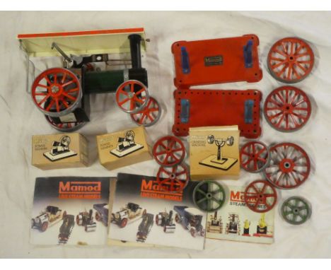 A Mamod steam tractor, various traction engine wheels, two boxed power hammers, grinding machine, etc